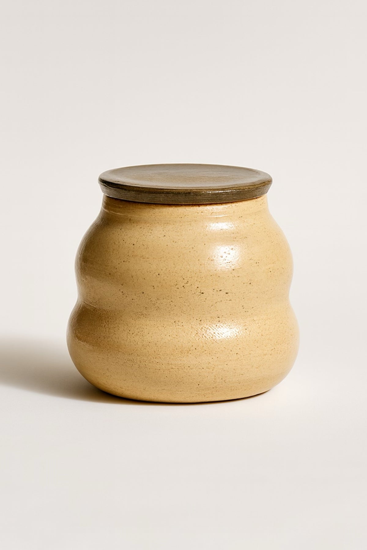 Round caramel stoneware lidded pot, warm tan glaze with natural speckle