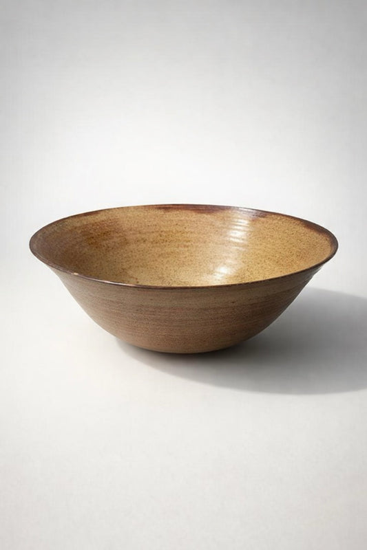 Extra large handmade ceramic bowl with ochre glaze